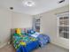 Bedroom features two twin beds and windows at 1050 Sunny Field Ct, Lawrenceville, GA 30043