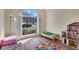 Bonus room with a large window and play area for children at 1050 Sunny Field Ct, Lawrenceville, GA 30043