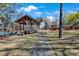 Community gazebo and tennis court surrounded by mature trees and lush landscaping at 1050 Sunny Field Ct, Lawrenceville, GA 30043
