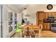 Bright kitchen featuring stainless appliances, wood cabinets, breakfast table, and light-filled windows at 1050 Sunny Field Ct, Lawrenceville, GA 30043
