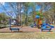 Community playground with a variety of equipment, benches, and mature trees at 1050 Sunny Field Ct, Lawrenceville, GA 30043
