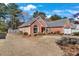 Charming single-story brick home with a well-manicured lawn and attached two car garage at 1050 Sunny Field Ct, Lawrenceville, GA 30043