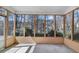 An enclosed sunroom featuring large windows and natural light, perfect for relaxing and enjoying the outdoors at 1050 Sunny Field Ct, Lawrenceville, GA 30043