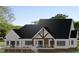 Rear elevation of home, featuring a large deck and plenty of natural light at 152 Sherwood Ln, Canton, GA 30115