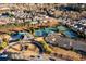 Wide aerial shot highlighting the community pool, tennis courts, and parking available to residents at 1560 Baygreen Rd, Suwanee, GA 30024
