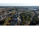 High aerial shot of a townhouse community nestled among dense trees near local roadways at 1560 Baygreen Rd, Suwanee, GA 30024