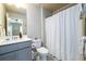 Bathroom with single sink vanity, and shower-tub combo at 1560 Baygreen Rd, Suwanee, GA 30024