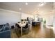 Open-concept living room and kitchen with hardwood floors and recessed lighting at 1560 Baygreen Rd, Suwanee, GA 30024