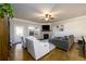 Cozy living room features a fireplace, comfortable seating, and natural light from the exterior doors at 1560 Baygreen Rd, Suwanee, GA 30024
