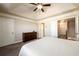 Bright and spacious main bedroom featuring a ceiling fan, and ensuite bathroom entrance at 1560 Baygreen Rd, Suwanee, GA 30024