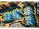 Aerial view of multiple well-maintained tennis courts in a residential community, surrounded by lush landscaping at 1560 Baygreen Rd, Suwanee, GA 30024