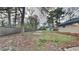 Large backyard is perfect for outdoor activities, featuring a shed and mature trees at 1735 W Austin Rd, Decatur, GA 30032
