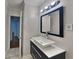 Modern bathroom boasts stylish vanity, sleek mirror, and contemporary lighting at 1735 W Austin Rd, Decatur, GA 30032