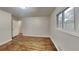 Neutral bedroom offers hardwood floors, bright windows, and white trim and walls at 1735 W Austin Rd, Decatur, GA 30032