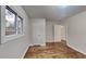 This bedroom features hardwood floors, closet, and bright windows at 1735 W Austin Rd, Decatur, GA 30032