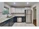 Well-lit kitchen featuring granite countertops, stainless steel appliances and ample cabinet space at 1735 W Austin Rd, Decatur, GA 30032