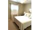 Cozy bedroom features neutral decor, a ceiling fan and natural light from a bright window at 3503 Saddlebrook Dr, Loganville, GA 30052