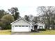 Charming single-Gathering home featuring a two-car garage and well-maintained landscaping at 3503 Saddlebrook Dr, Loganville, GA 30052