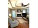 Cozy living room with a fireplace and trey ceiling at 3503 Saddlebrook Dr, Loganville, GA 30052