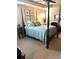 Serene bedroom featuring a four poster bed and neutral decor at 3503 Saddlebrook Dr, Loganville, GA 30052