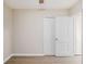 This bedroom has light-colored walls and a light wood floor and two closets at 864 Northview Dr, Forest Park, GA 30297