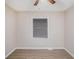 This bedroom has light-colored walls and a light wood floor and a ceiling fan at 864 Northview Dr, Forest Park, GA 30297