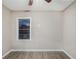 This bedroom has light-colored walls and a light wood floor and a ceiling fan at 864 Northview Dr, Forest Park, GA 30297