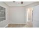 This bedroom has light-colored walls and a light wood floor and a doorway at 864 Northview Dr, Forest Park, GA 30297