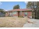 Charming brick home featuring a red roof, stone steps, and a well-maintained front yard at 864 Northview Dr, Forest Park, GA 30297
