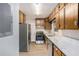Functional kitchen with stainless steel appliances, light countertops, and ample cabinet space at 864 Northview Dr, Forest Park, GA 30297