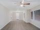 Bright living room with gray vinyl plank flooring, ceiling fan, and natural light from two windows at 864 Northview Dr, Forest Park, GA 30297