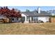 Spacious backyard features a patio, seating and grilling area, and mature shade trees at 5330 Maltdie Ct, Sugar Hill, GA 30518