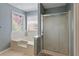Bright bathroom with separate tub and shower at 5330 Maltdie Ct, Sugar Hill, GA 30518