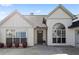 Inviting front entrance features a new door, large windows, and charming curb appeal at 5330 Maltdie Ct, Sugar Hill, GA 30518