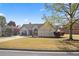 Well maintained single Gathering home with lush landscaping on a sunny day at 5330 Maltdie Ct, Sugar Hill, GA 30518