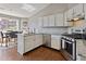Updated kitchen with stainless steel appliances, granite counters and an eat-in breakfast nook at 5330 Maltdie Ct, Sugar Hill, GA 30518
