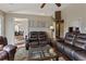 Spacious living room showcasing a leather sofa set, coffee table, and natural light at 5330 Maltdie Ct, Sugar Hill, GA 30518