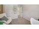 Bedroom showcases a neutral color scheme with white doors and plush carpeting at 5897 Mattan Trl # 67, Lithonia, GA 30058