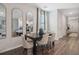 Dining room features modern furnishings and decor, set off of a hardwood floor and natural light at 5897 Mattan Trl # 67, Lithonia, GA 30058