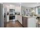 Kitchen boasts stainless steel appliances, granite countertops, and white cabinets at 5897 Mattan Trl # 67, Lithonia, GA 30058