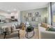 Comfortable living room featuring modern decor, stylish furnishings, an open layout, and kitchen at 5897 Mattan Trl # 67, Lithonia, GA 30058
