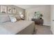 Main bedroom boasts neutral décor, carpet, and a decorative accent wall at 5897 Mattan Trl # 67, Lithonia, GA 30058