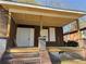 New wood porch with brick and grey stone supports with front door at 707 Dill Sw Ave, Atlanta, GA 30310