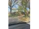 View of a street and shrubbery from a car's dashboard at 707 Dill Sw Ave, Atlanta, GA 30310