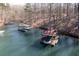 Aerial view of a dock on the lake, featuring seating and boat storage at 7725 Bold Springs Xing, Cumming, GA 30041