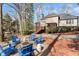 Beautiful backyard with a deck, and firepit area with comfortable Adirondack chairs at 7725 Bold Springs Xing, Cumming, GA 30041