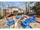 Backyard fire pit area featuring Adirondack chairs, perfect for outdoor gatherings at 7725 Bold Springs Xing, Cumming, GA 30041
