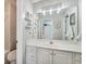 Bathroom featuring a spacious vanity and large mirror, plus a view of a nearby shower at 7725 Bold Springs Xing, Cumming, GA 30041