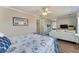 Relaxing bedroom featuring nautical decor, ceiling fan, and a comfortable seating area at 7725 Bold Springs Xing, Cumming, GA 30041