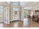 Inviting foyer featuring hardwood floors, a front door with glass, and ample natural light at 7725 Bold Springs Xing, Cumming, GA 30041